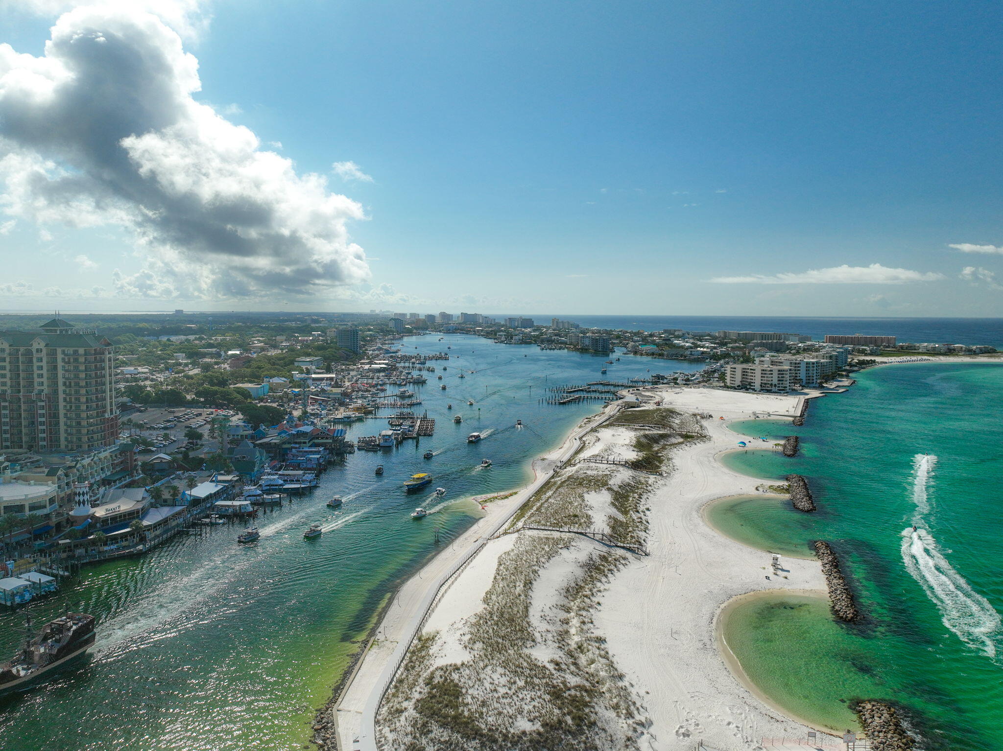 5 Calhoun Avenue, Unit 203 Destin, FL 32541 - Photo 66 of 67 an aerial view of a house with a yard and lake view in back
