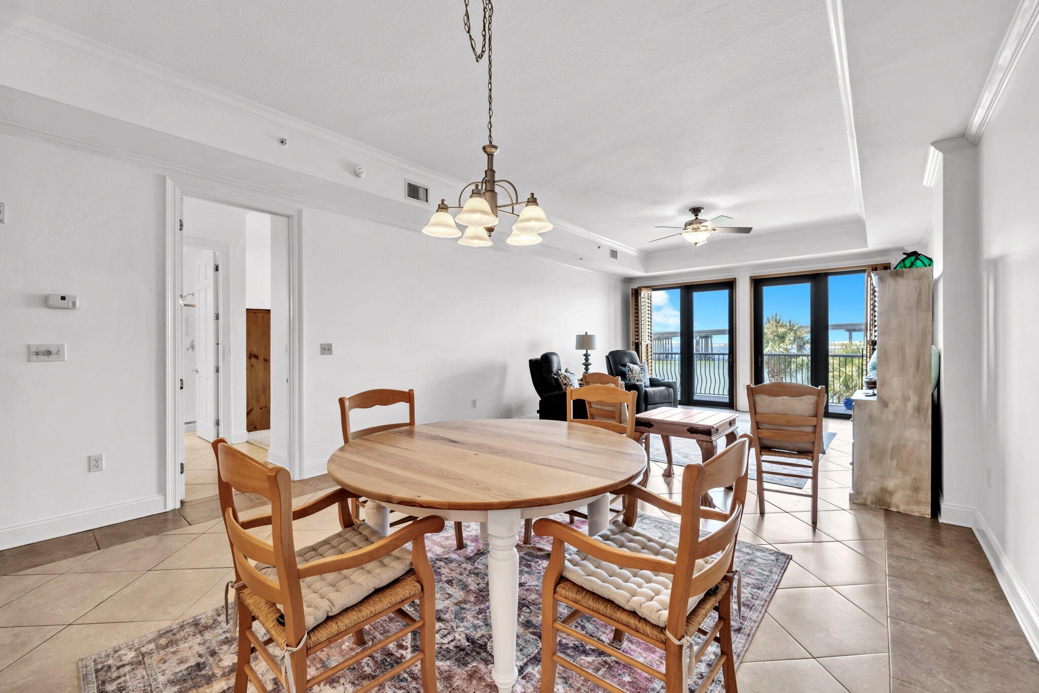 5 Calhoun Avenue, Unit 203 Destin, FL 32541 - Photo 7 of 67 a dining room with furniture and window