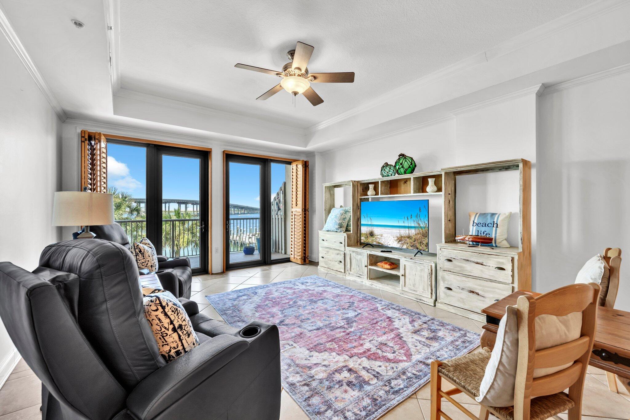 5 Calhoun Avenue, Unit 203 Destin, FL 32541 - Photo 10 of 67 a living room with furniture and a flat screen tv