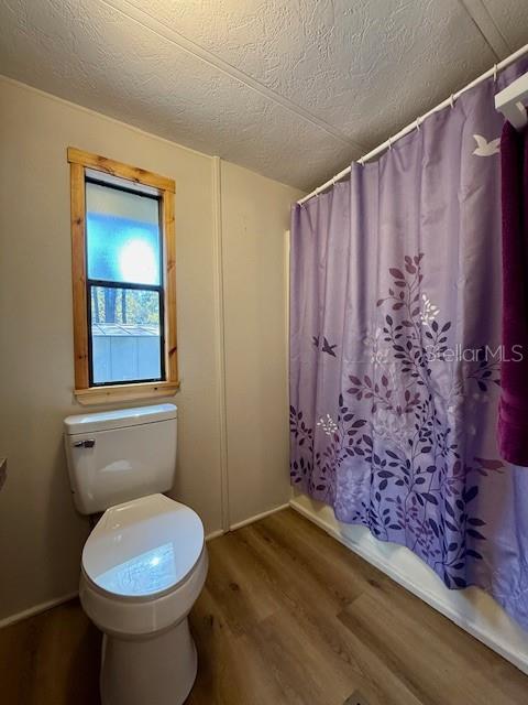 5043 Goodwin Road Brooksville, FL 34601 - Photo 18 of 47 a bathroom with a toilet and a shower
