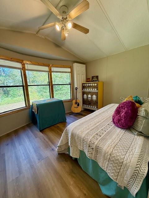 5043 Goodwin Road Brooksville, FL 34601 - Photo 20 of 47 a bedroom with a large bed and a large window