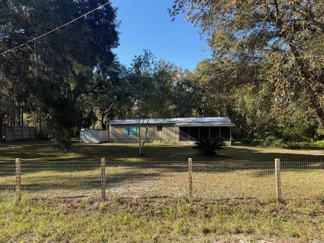 5043 Goodwin Road Brooksville, FL 34601 - Photo 2 of 47 a view of a yard