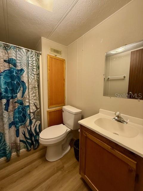5043 Goodwin Road Brooksville, FL 34601 - Photo 22 of 47 a bathroom with a sink toilet and shower