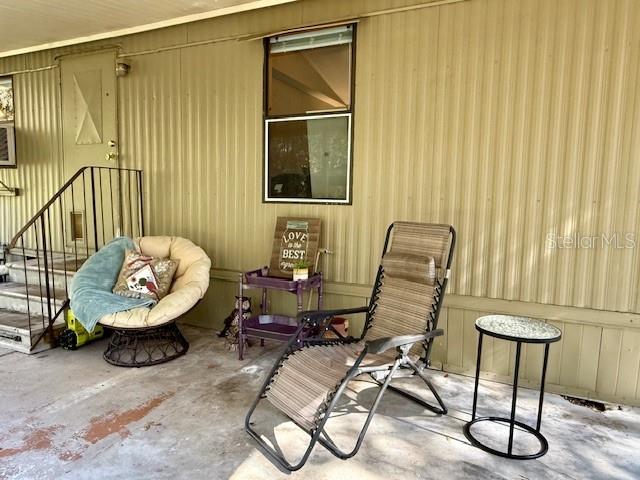 5043 Goodwin Road Brooksville, FL 34601 - Photo 24 of 47 a view of a workspace with furniture and a window