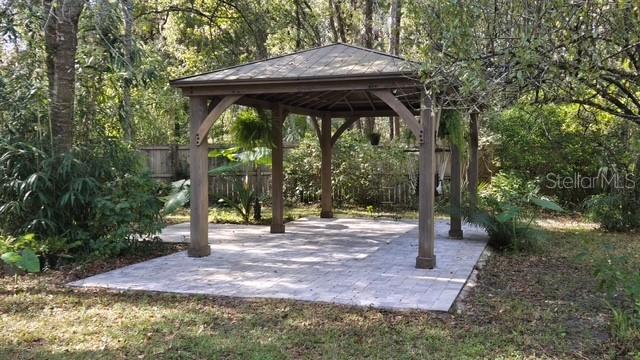 5043 Goodwin Road Brooksville, FL 34601 - Photo 30 of 47 a view of backyard with green space and trees