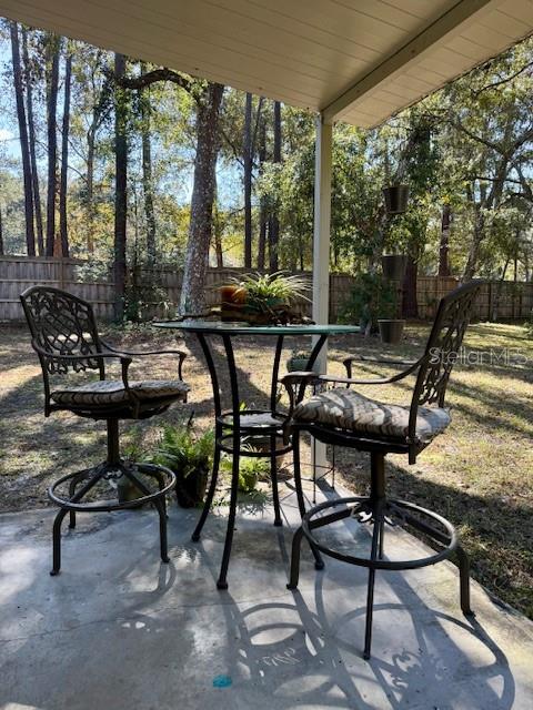 5043 Goodwin Road Brooksville, FL 34601 - Photo 46 of 47 a view of chairs and tables in a patio