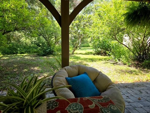 5043 Goodwin Road Brooksville, FL 34601 - Photo 6 of 47 a living room with yard and furniture