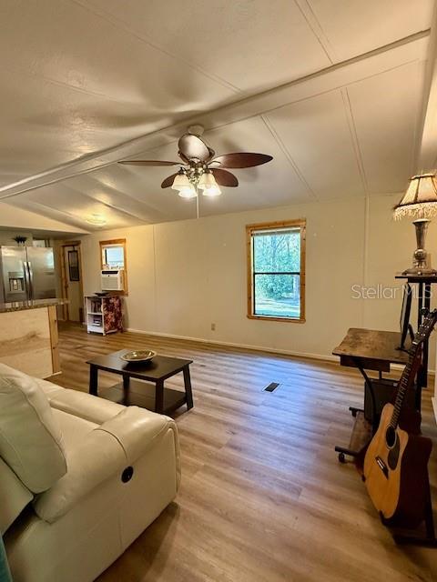 5043 Goodwin Road Brooksville, FL 34601 - Photo 9 of 47 a bedroom with furniture and wooden floor