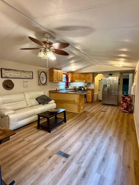 5043 Goodwin Road Brooksville, FL 34601 - Photo 10 of 47 a living room with furniture and a wooden floor