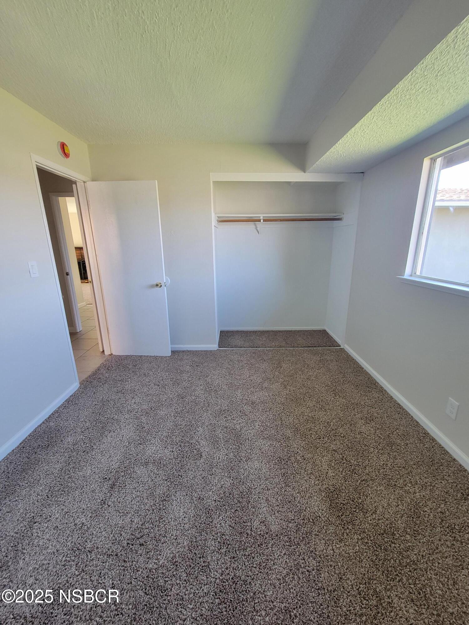 1328 West Willow Avenue Lompoc, CA 93436 - Photo 15 of 22 an empty room with windows