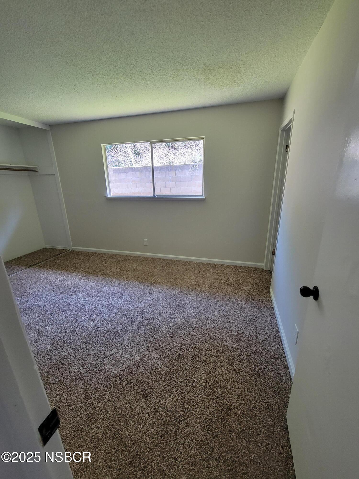 1328 West Willow Avenue Lompoc, CA 93436 - Photo 16 of 22 an empty room with windows