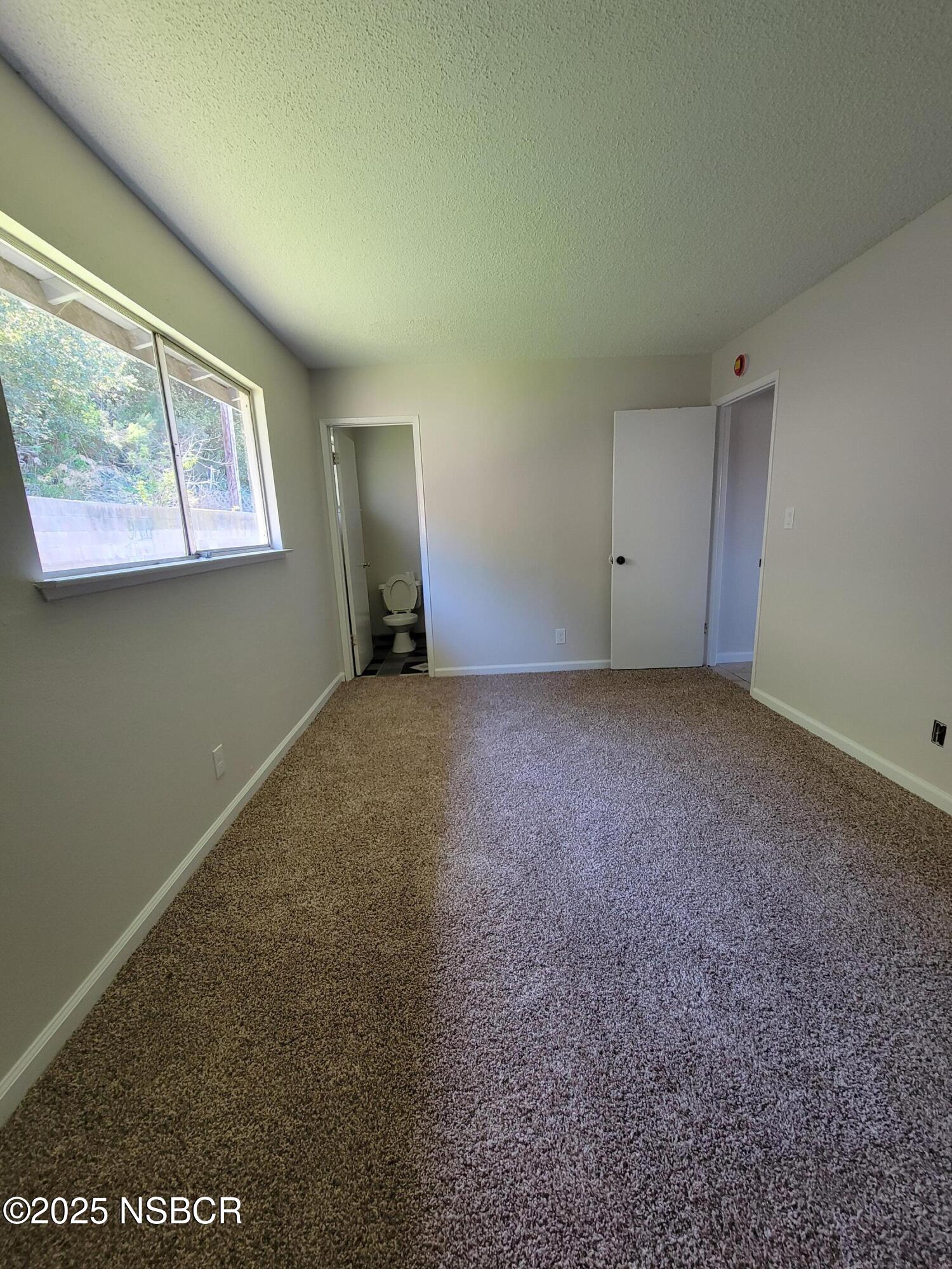 1328 West Willow Avenue Lompoc, CA 93436 - Photo 17 of 22 a view of an empty room with a window