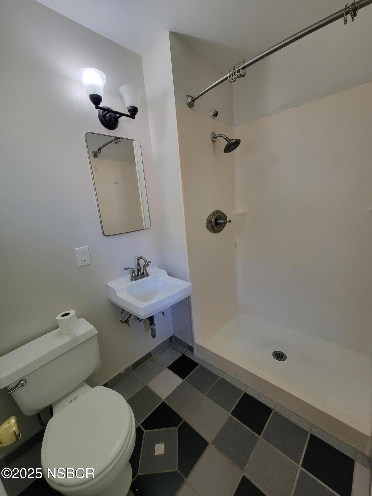 1328 West Willow Avenue Lompoc, CA 93436 - Photo 19 of 22 a bathroom with a sink toilet and shower