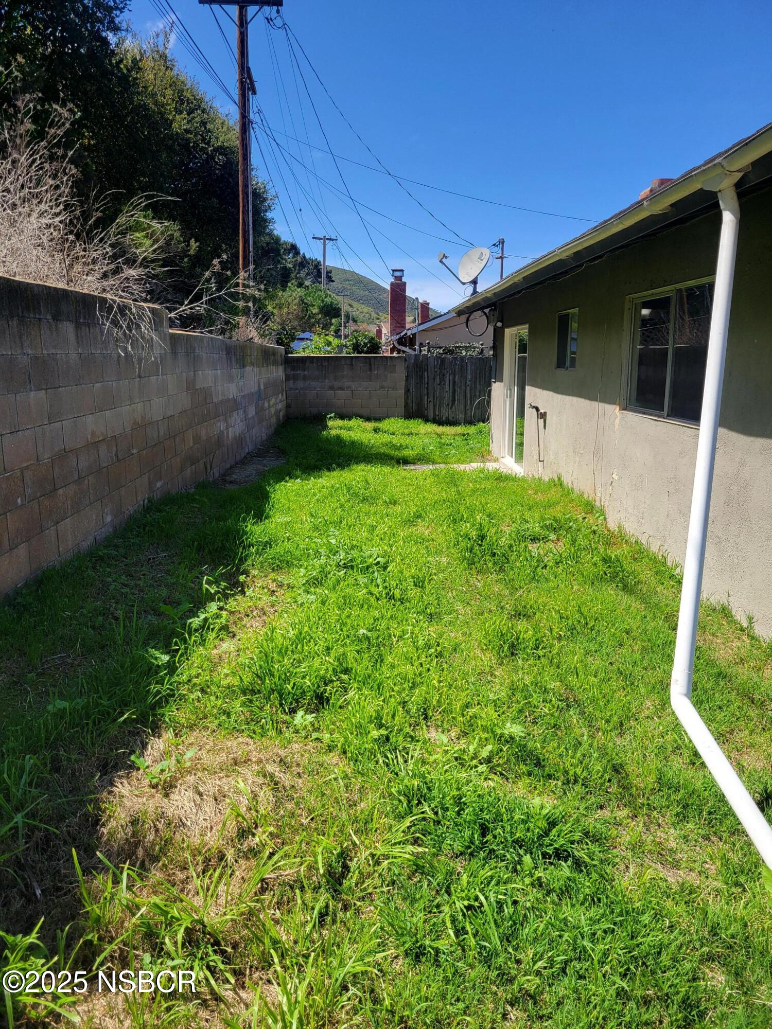 1328 West Willow Avenue Lompoc, CA 93436 - Photo 21 of 22 a front view of a house with garden