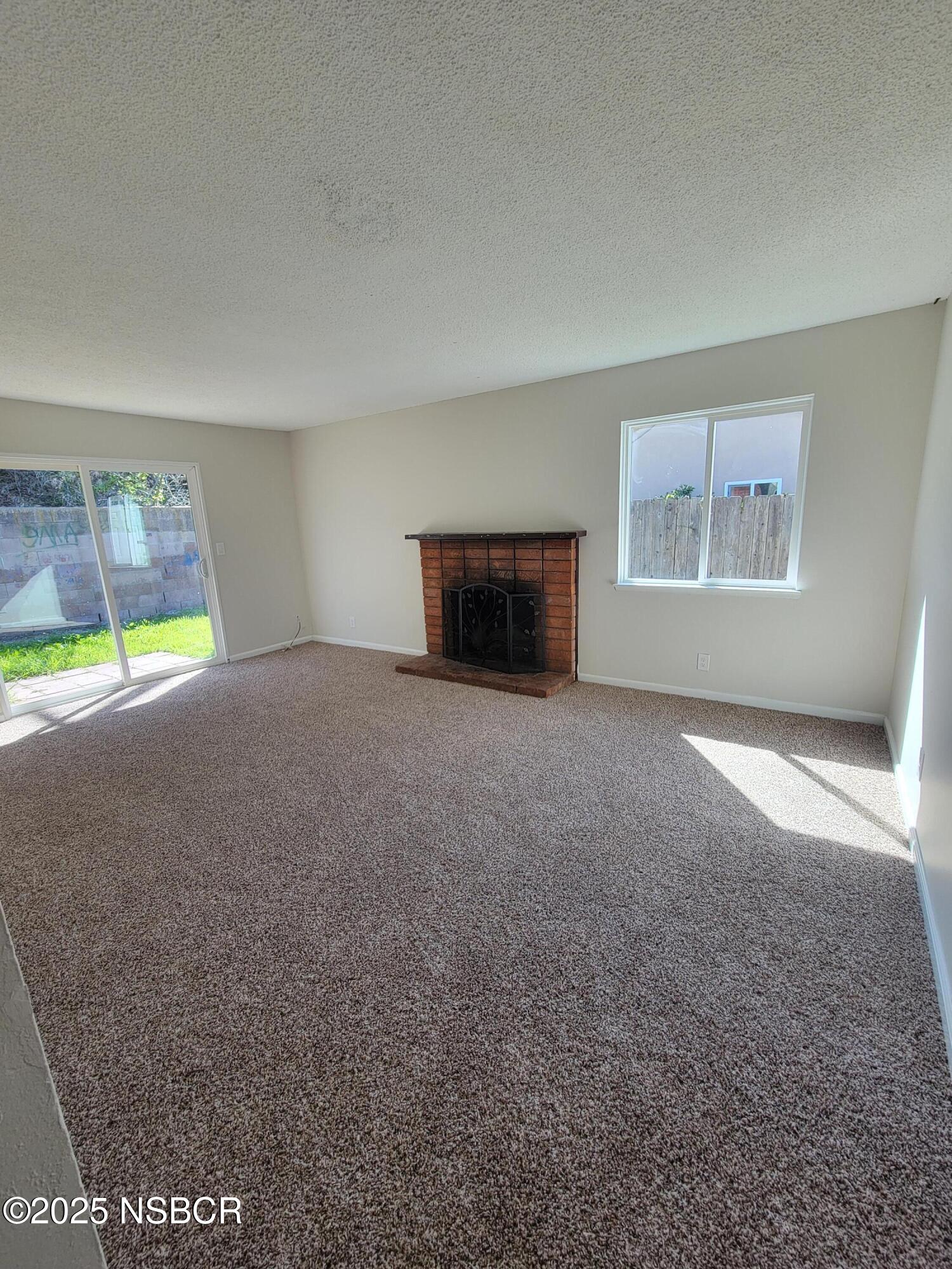 1328 West Willow Avenue Lompoc, CA 93436 - Photo 3 of 22 a view of an empty room with a window