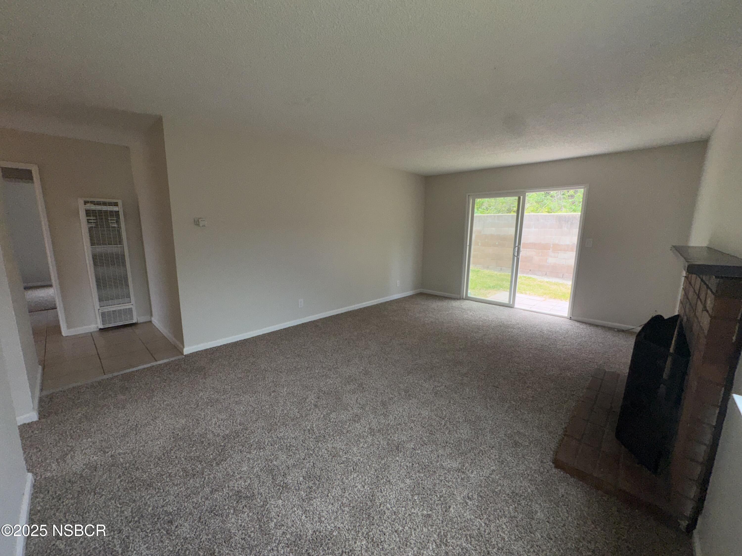 1328 West Willow Avenue Lompoc, CA 93436 - Photo 4 of 22 an empty room with windows