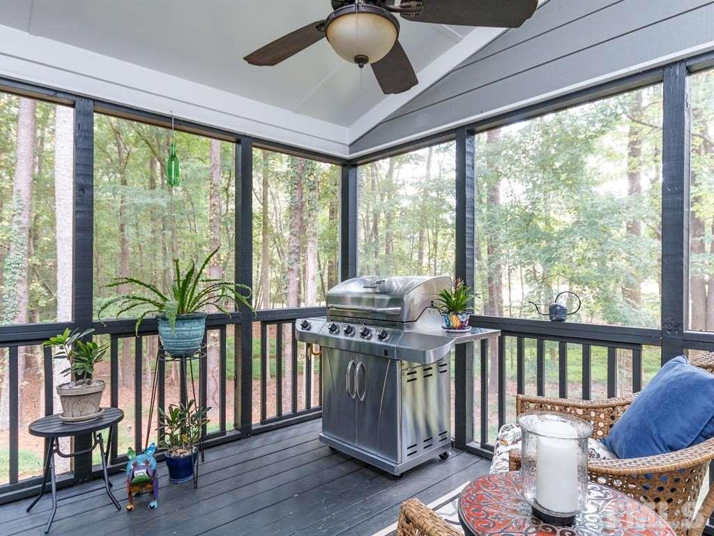 11916 Soco Court Raleigh, NC 27614 - Photo 22 of 25 a living room filled with furniture and a floor to ceiling window