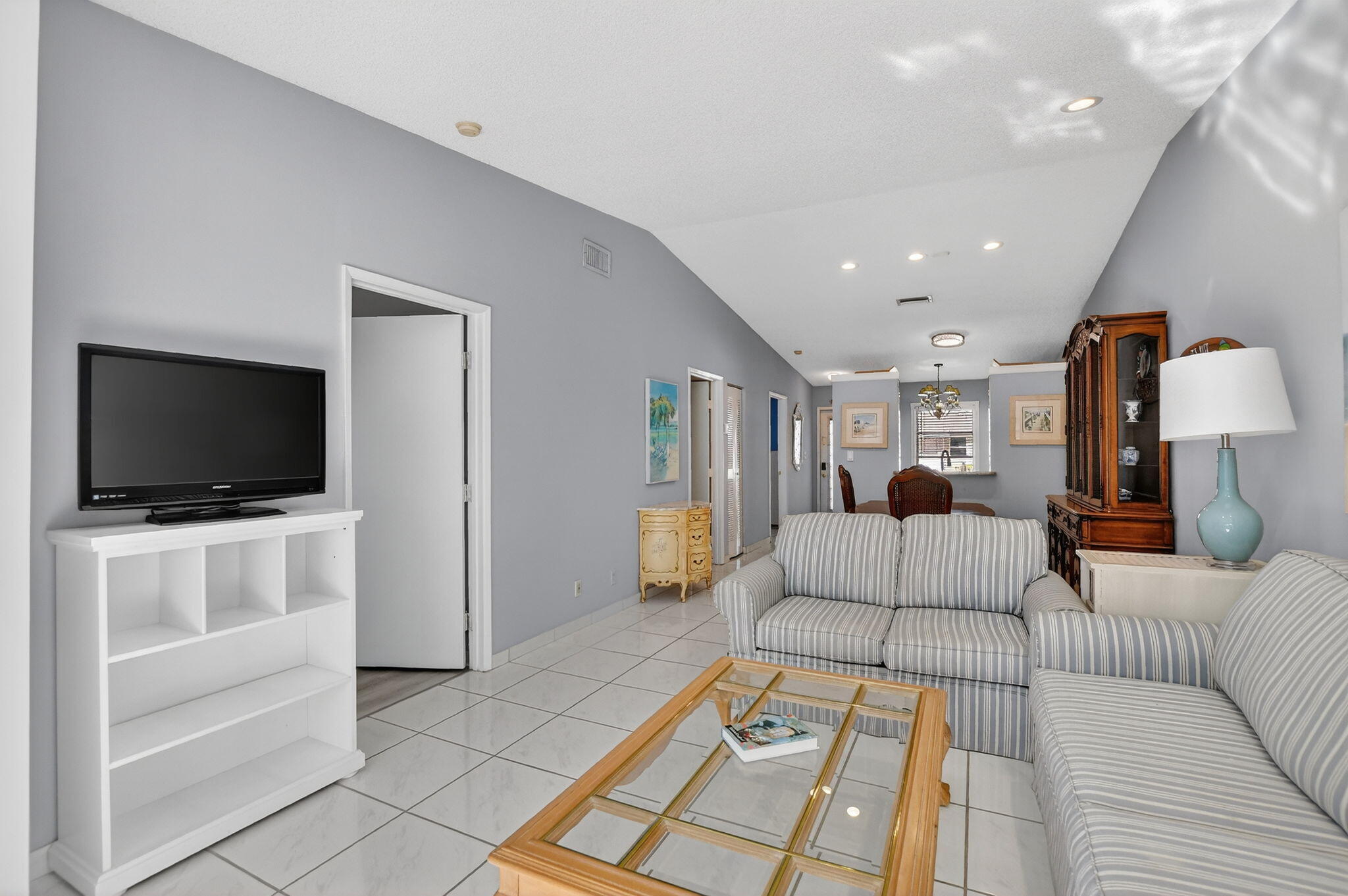 8622 Dreamside Lane Boca Raton, FL 33496 - Photo 11 of 36 a living room with furniture and a flat screen tv