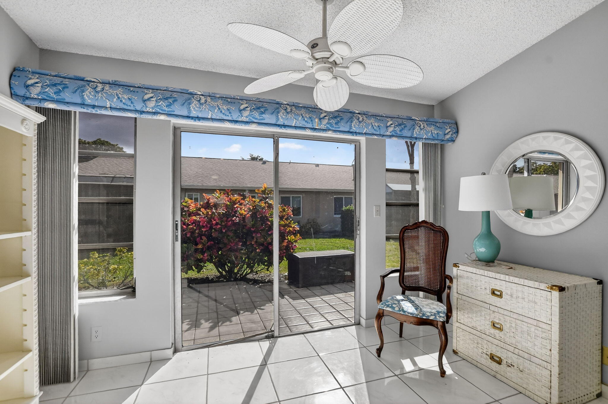 8622 Dreamside Lane Boca Raton, FL 33496 - Photo 14 of 36 a living room with furniture a chandelier and a large window