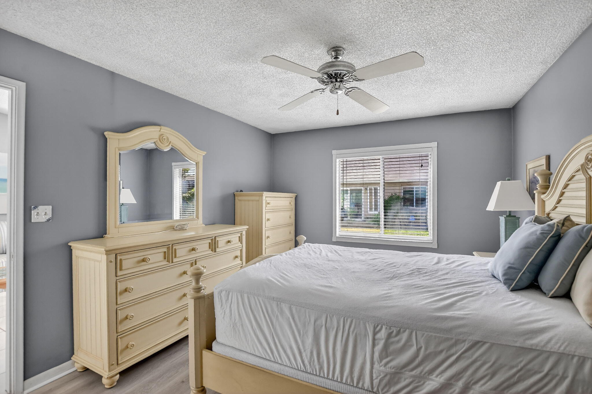 8622 Dreamside Lane Boca Raton, FL 33496 - Photo 18 of 36 a bedroom with a bed and a chandelier