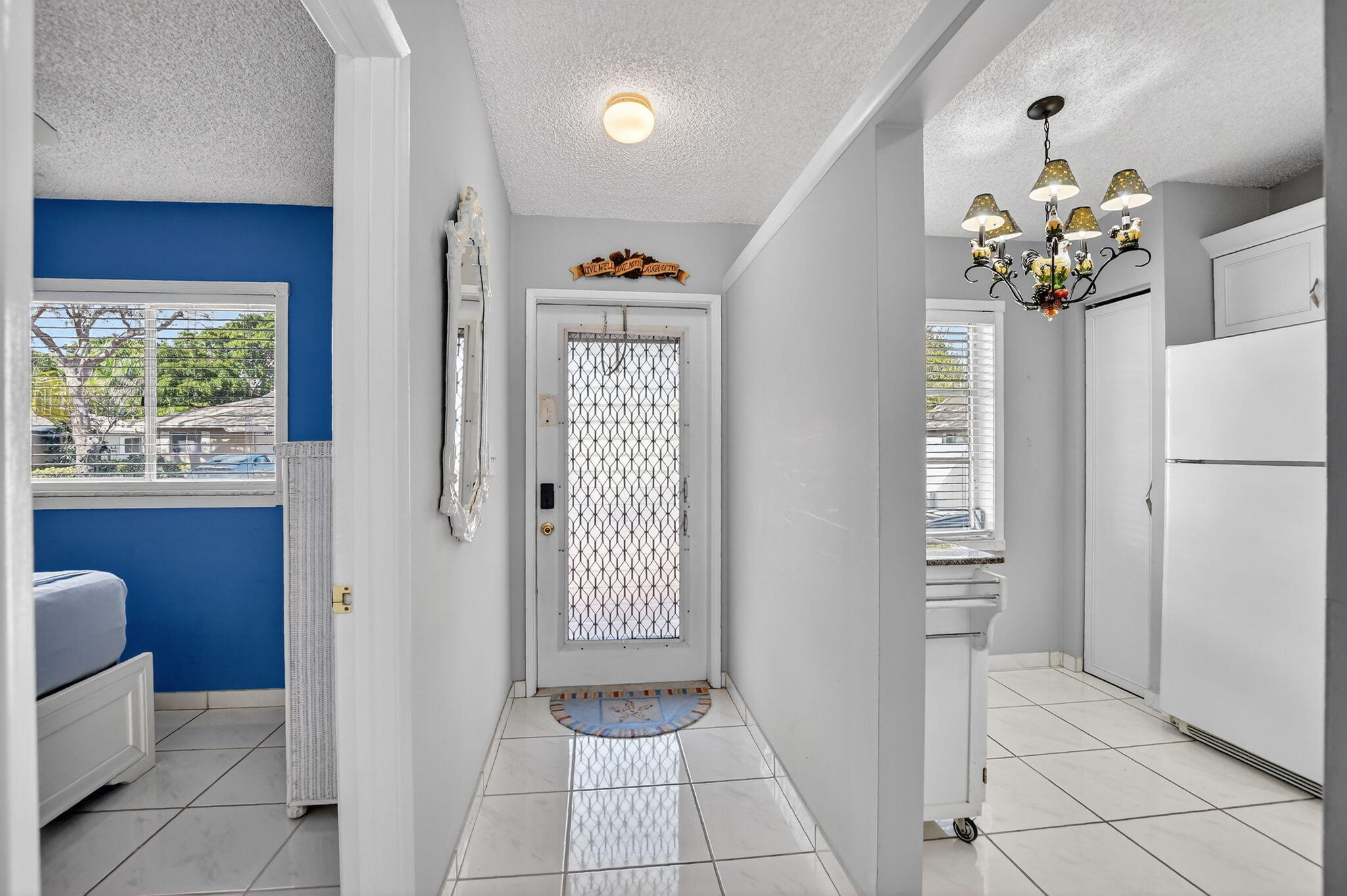 8622 Dreamside Lane Boca Raton, FL 33496 - Photo 3 of 36 a view of an entryway with wooden floor