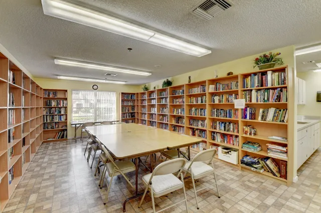 a room with furniture and a book shelf