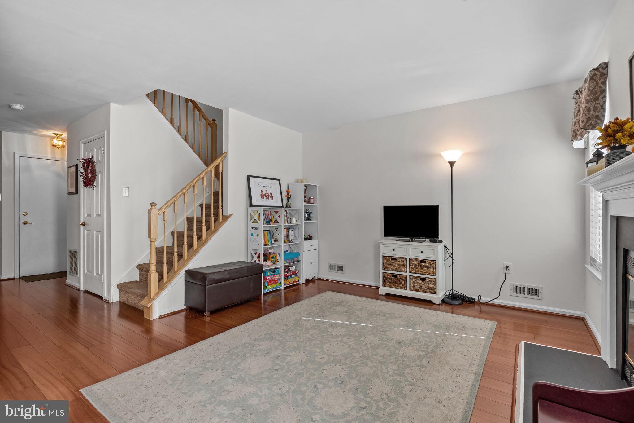 102 Broadleaf Place Newtown, PA 18940 - Photo 15 of 47 a living room with furniture and a flat screen tv