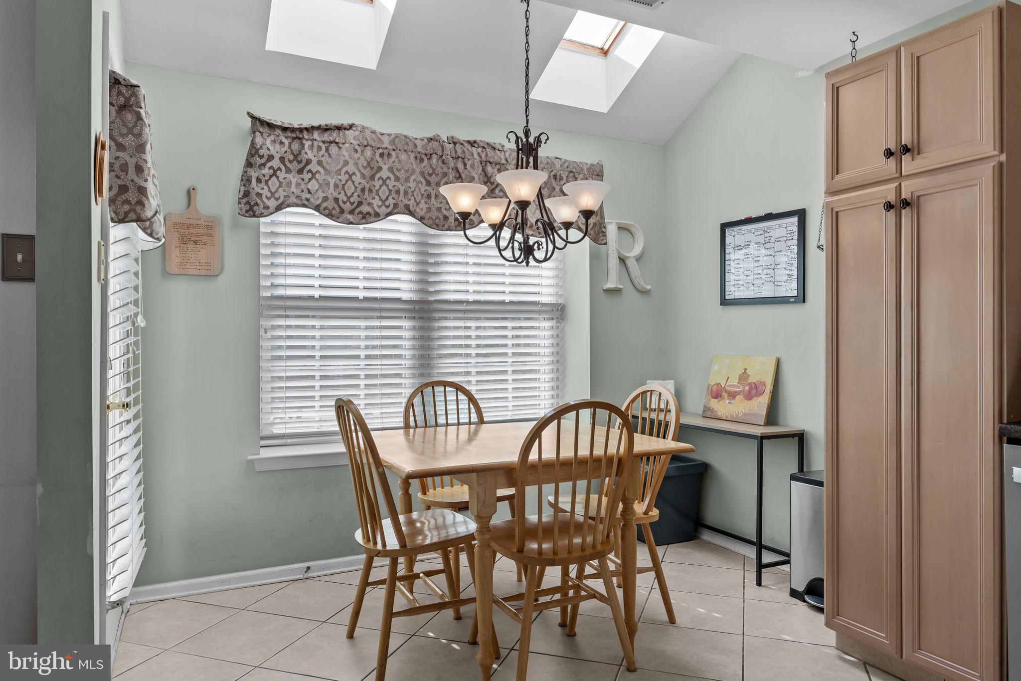 102 Broadleaf Place Newtown, PA 18940 - Photo 21 of 47 a view of a dining room with furniture and chandelier