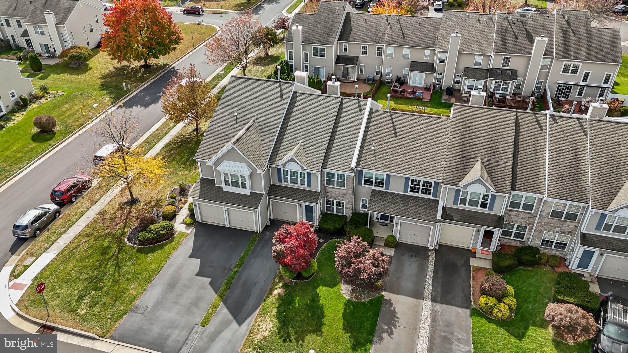 102 Broadleaf Place Newtown, PA 18940 - Photo 41 of 47 an aerial view of multiple houses with a yard