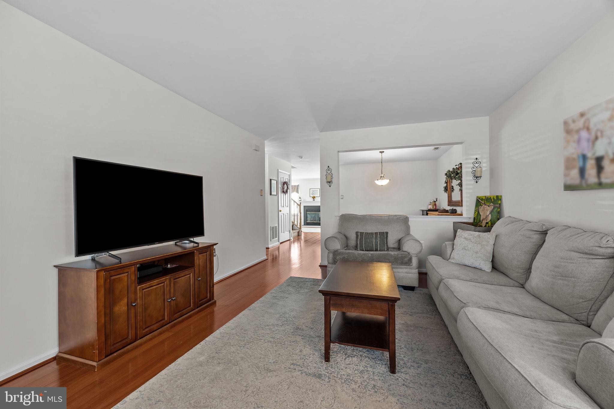 102 Broadleaf Place Newtown, PA 18940 - Photo 7 of 47 a living room with furniture and a flat screen tv