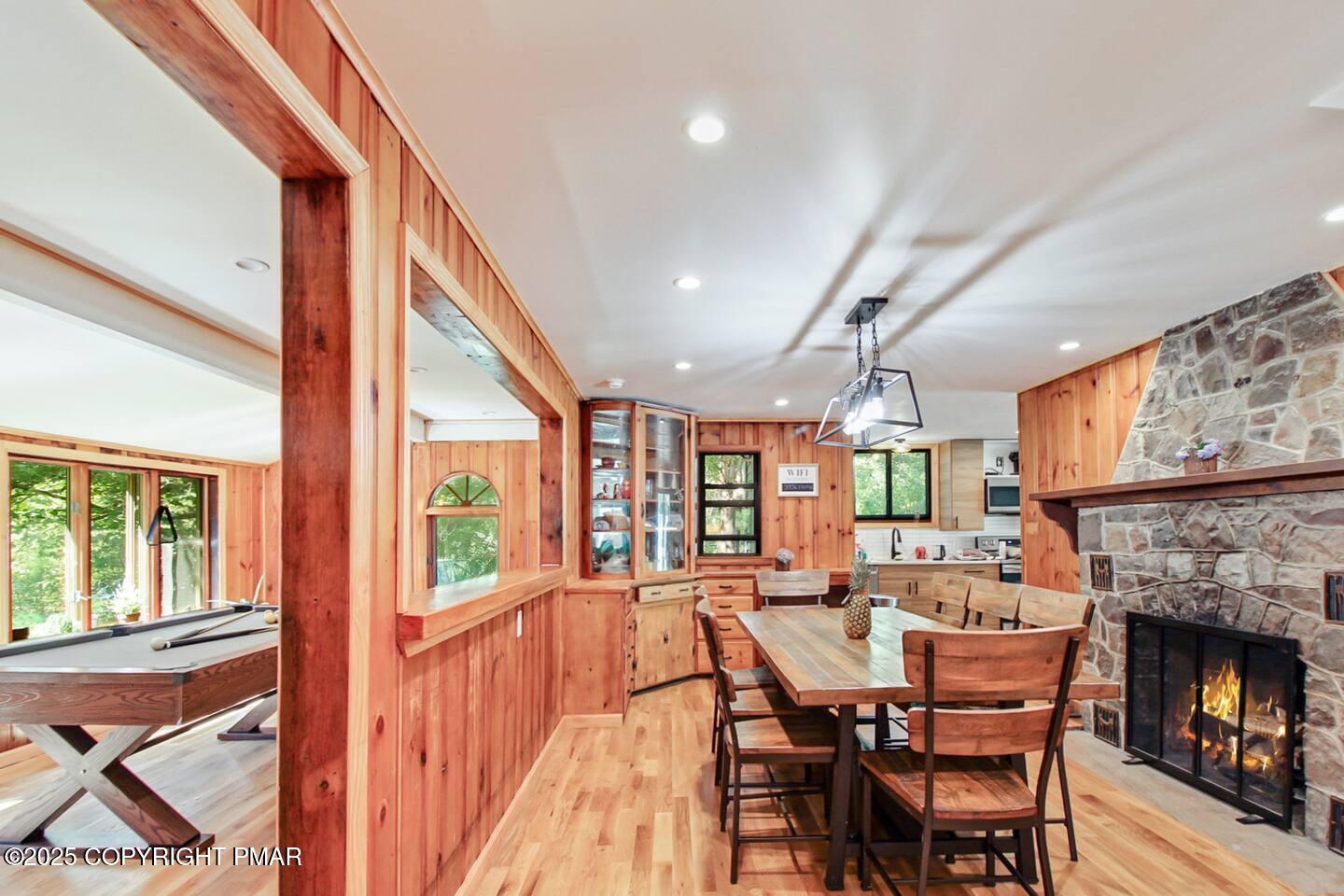 117 Bollinger Road Kunkletown, PA 18058 - Photo 13 of 25 a dining room with furniture a fireplace and large windows