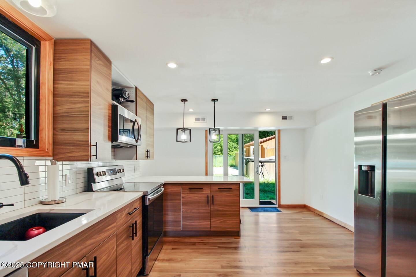 117 Bollinger Road Kunkletown, PA 18058 - Photo 16 of 25 a kitchen with stainless steel appliances granite countertop a refrigerator and a sink