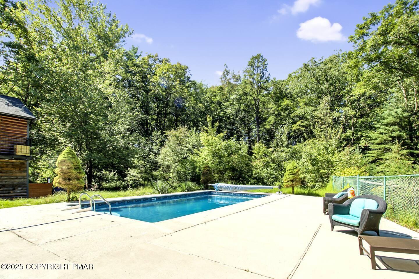 117 Bollinger Road Kunkletown, PA 18058 - Photo 2 of 25 a view of a swimming pool with chairs