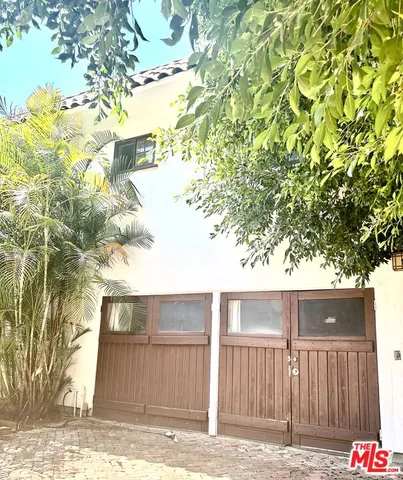 a kitchen with stainless steel appliances granite countertop a refrigerator and microwave