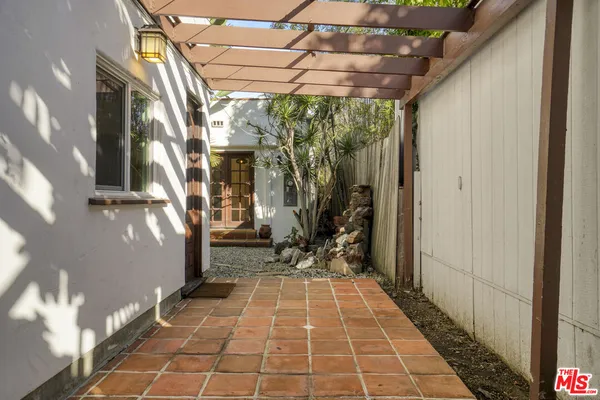 a view of a pathway with a patio