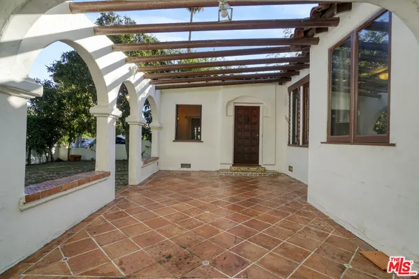 a view of a building with a door and a outdoor space