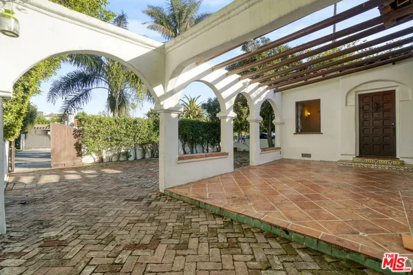 a view of a porch with a tree