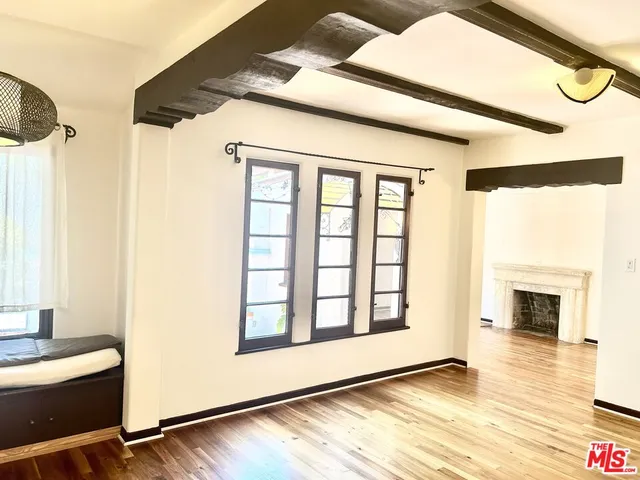 a large kitchen with stainless steel appliances granite countertop a stove and a sink