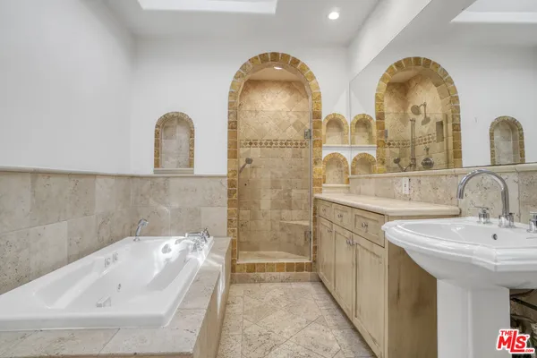 a bathroom with a double vanity sink and mirror