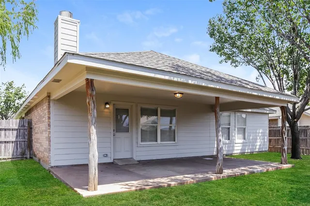 a view of a backyard with a garden and plants