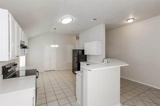 a view of a storage & utility room with a sink
