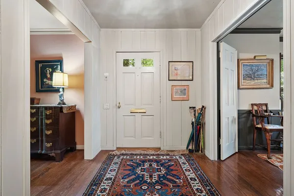 a view of room with furniture and wooden floor