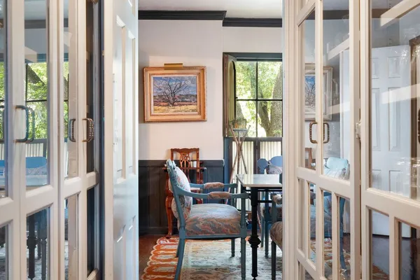 a view of a dining room with furniture window and wooden floor
