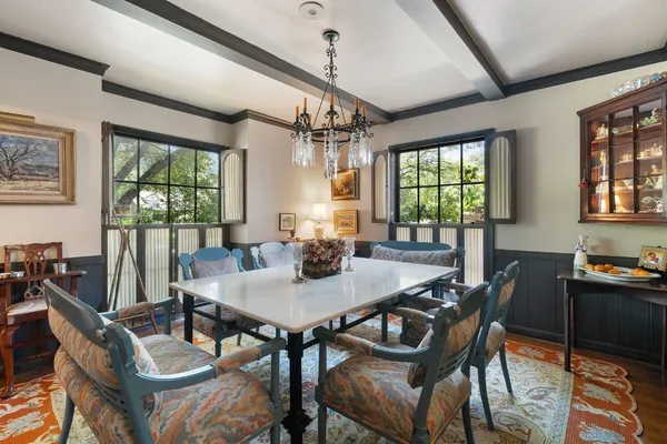 a view of a dining room with furniture window and outside view
