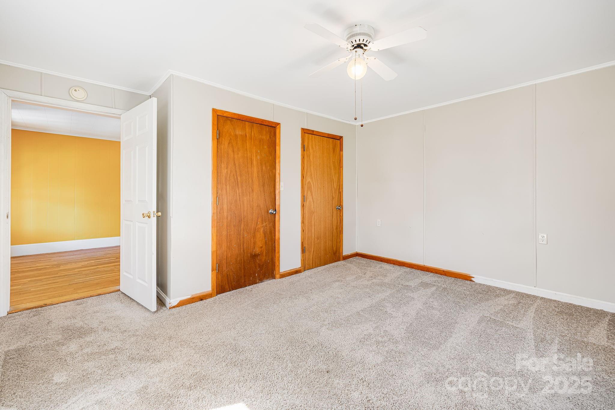 4243 Old Clyde Road Clyde, NC 28721 - Photo 15 of 37 a view of empty room with ceiling fan