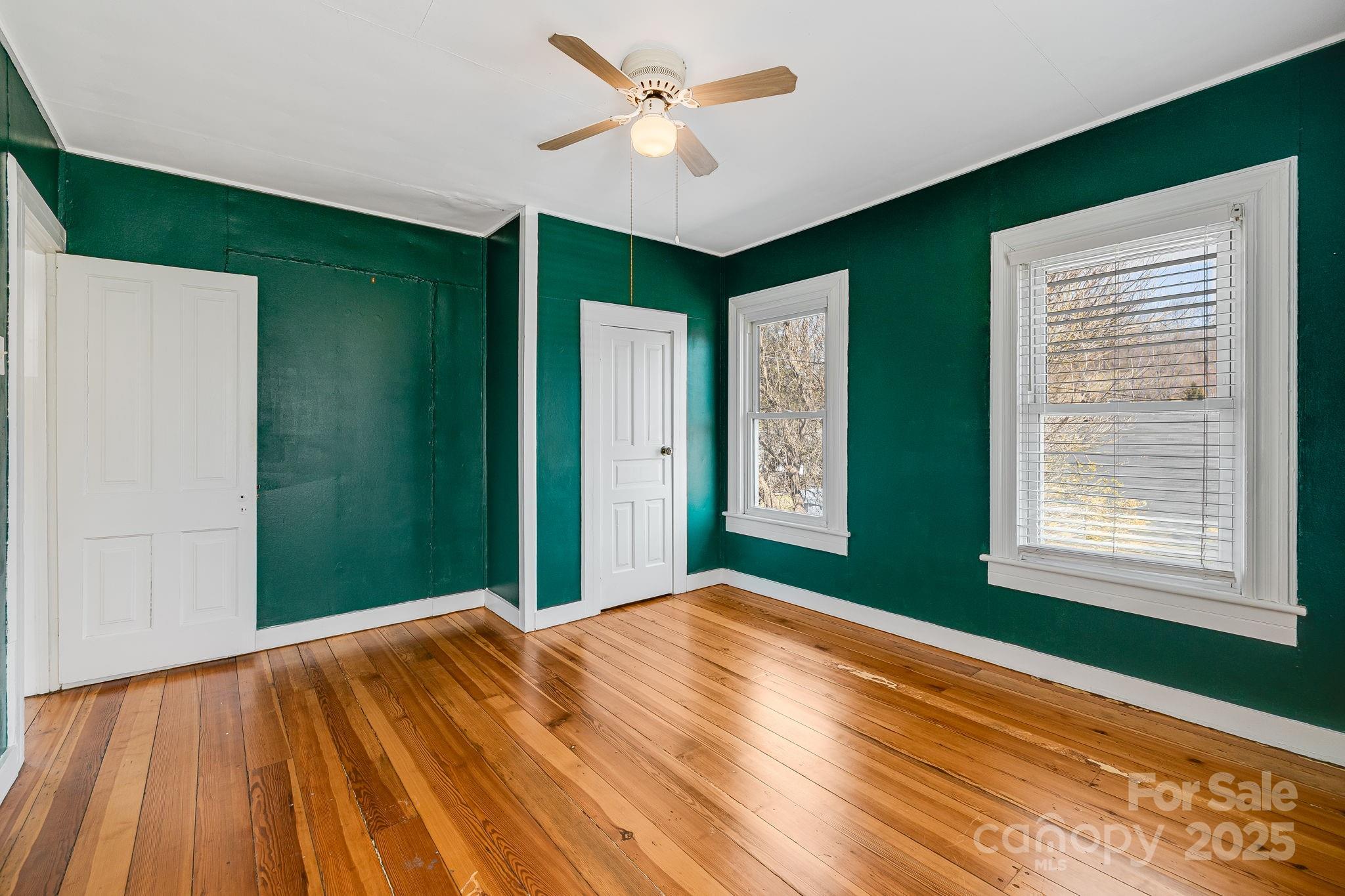4243 Old Clyde Road Clyde, NC 28721 - Photo 20 of 37 a bedroom with a bed and a window