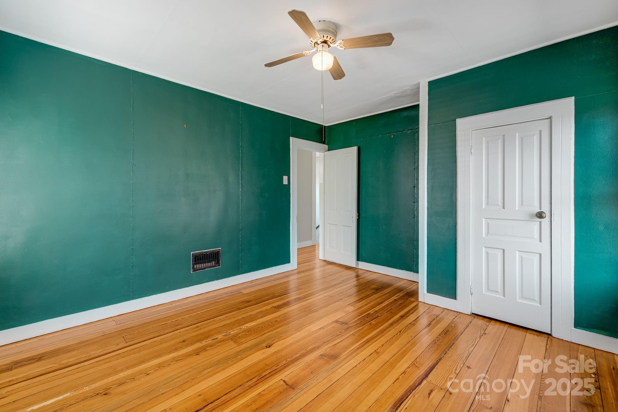 4243 Old Clyde Road Clyde, NC 28721 - Photo 21 of 37 a view of room with window and ceiling fan