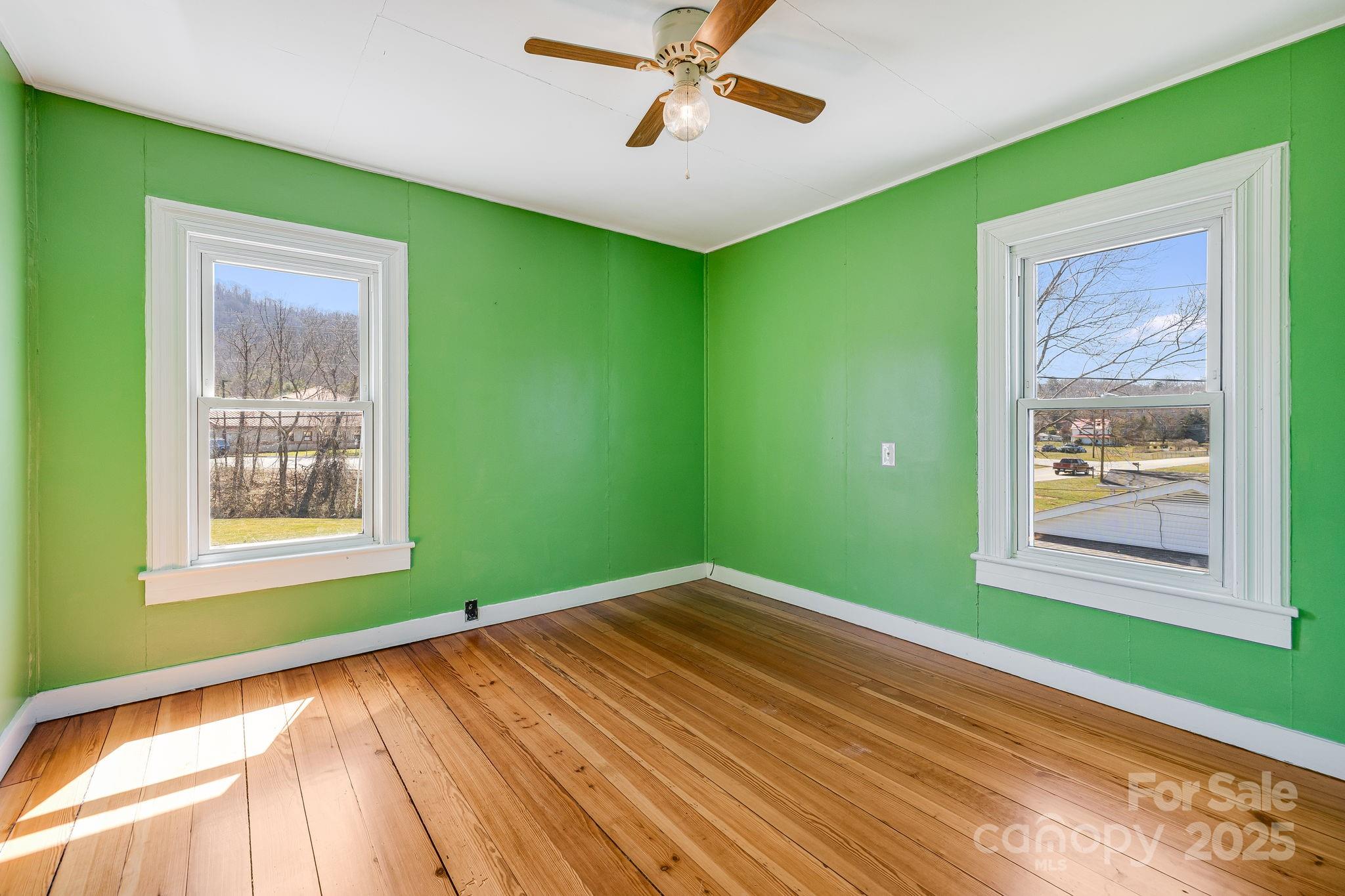4243 Old Clyde Road Clyde, NC 28721 - Photo 23 of 37 a view of a room that has a bed and a window
