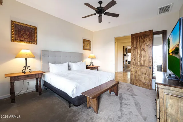 a bathroom with a double vanity sink mirror and shower