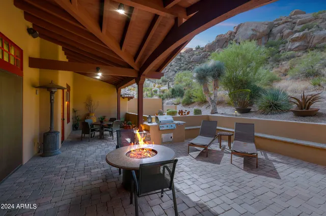 a view of a chairs and table in a patio